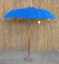 Bali umbrella, dazzling blue with metal coins and golden hearts hanging around the edge, ø 230 cm and 250cm height 